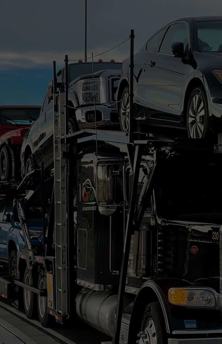 mobile-friendly image of a car hauler truck loaded with cars