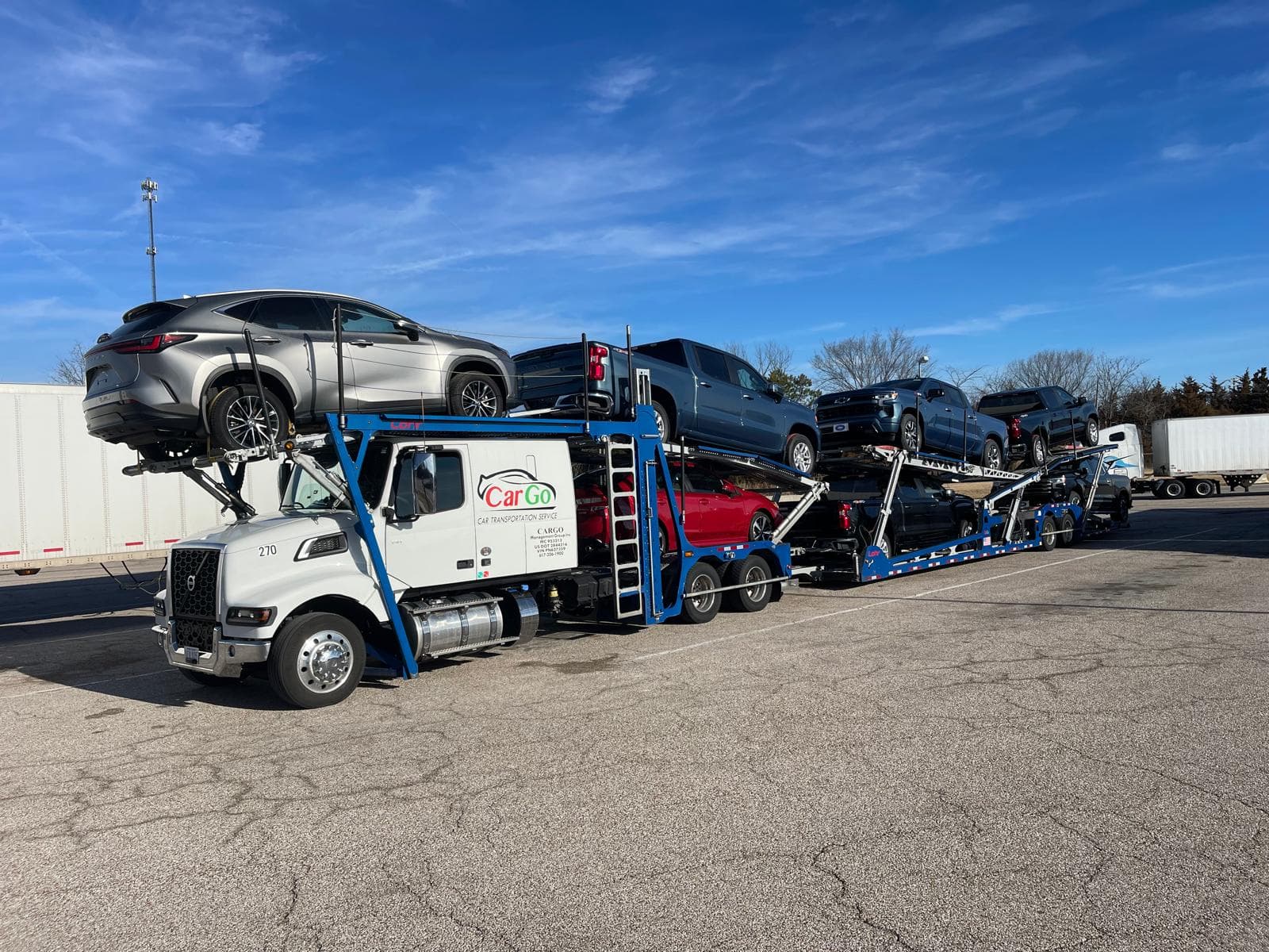 mobile-friendly image of a car hauler truck loaded with cars